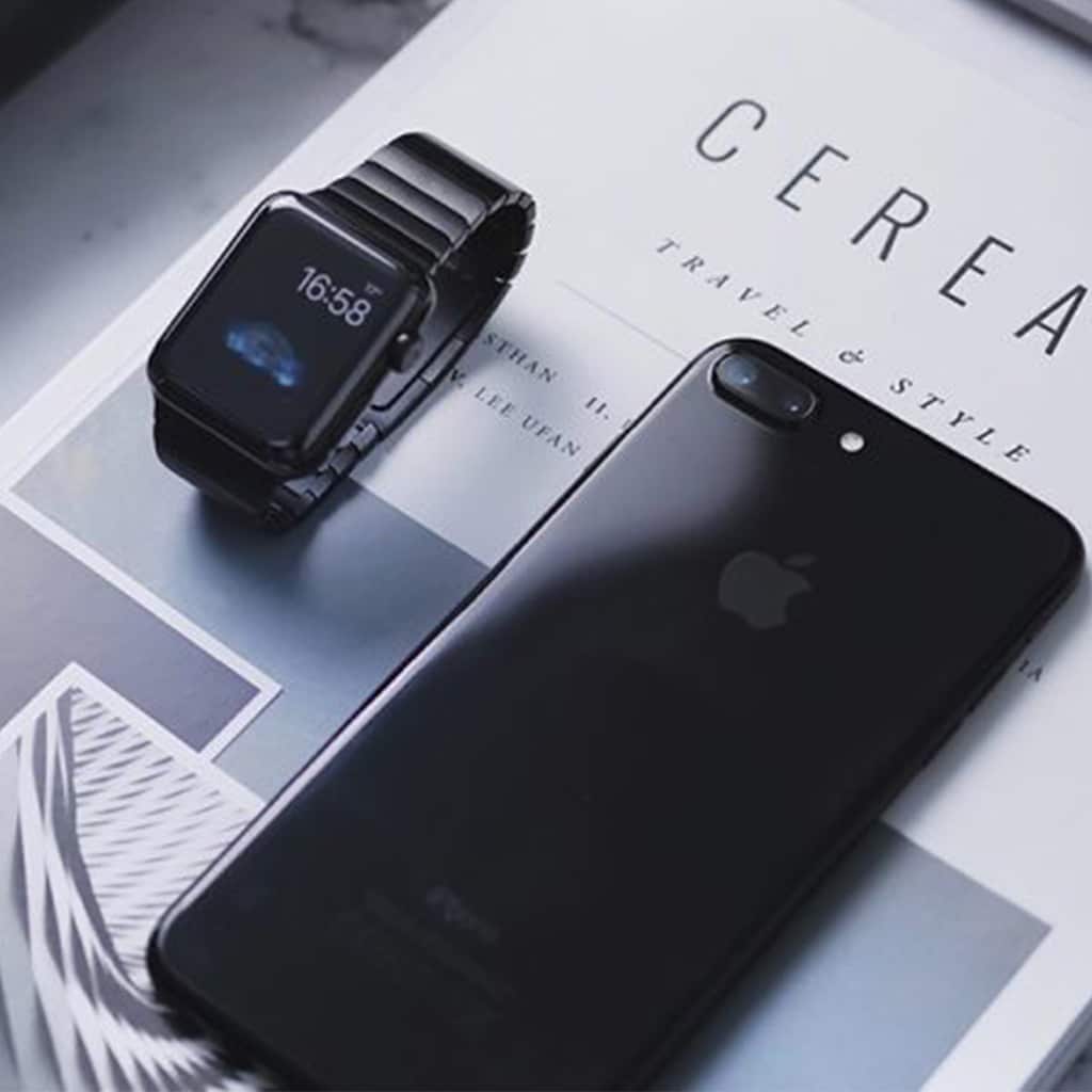 corporate travellers phone and watch on travel magazines