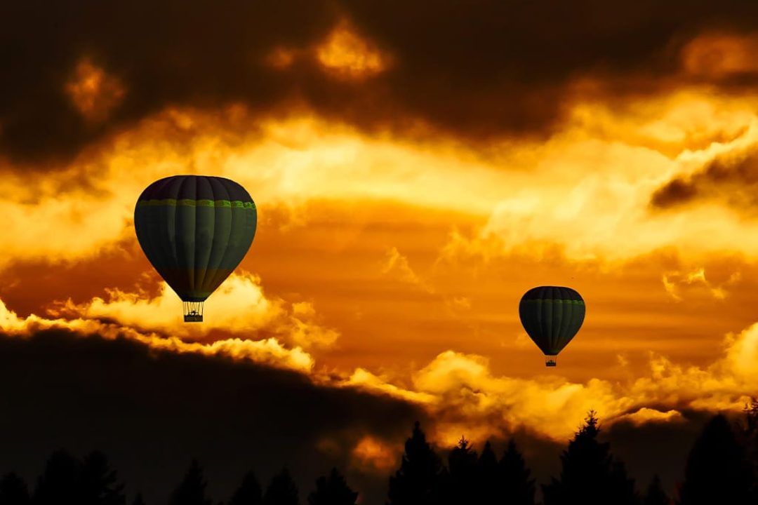 Gold sky with hot air balloons